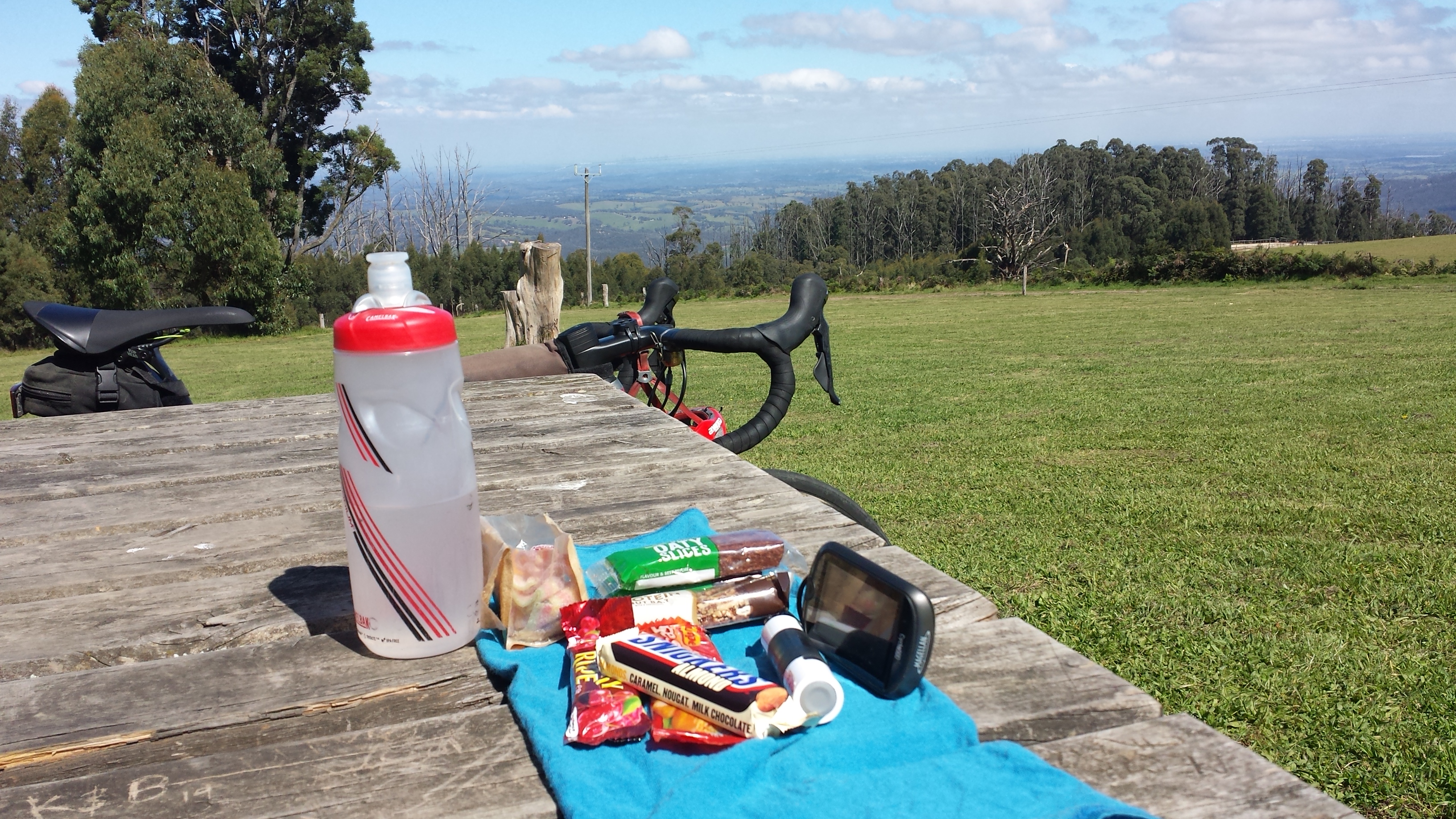 Picnic lunch, sunshine, bike and view over Melbourne from Kinglake
