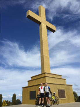 Mt. Macedon memorial cross with 2 cyclists